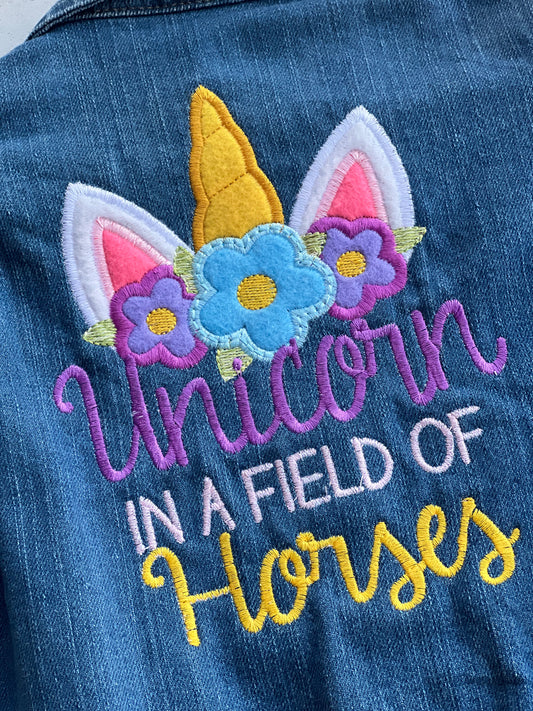 Unicorn in a field of horses Jean Jacket
